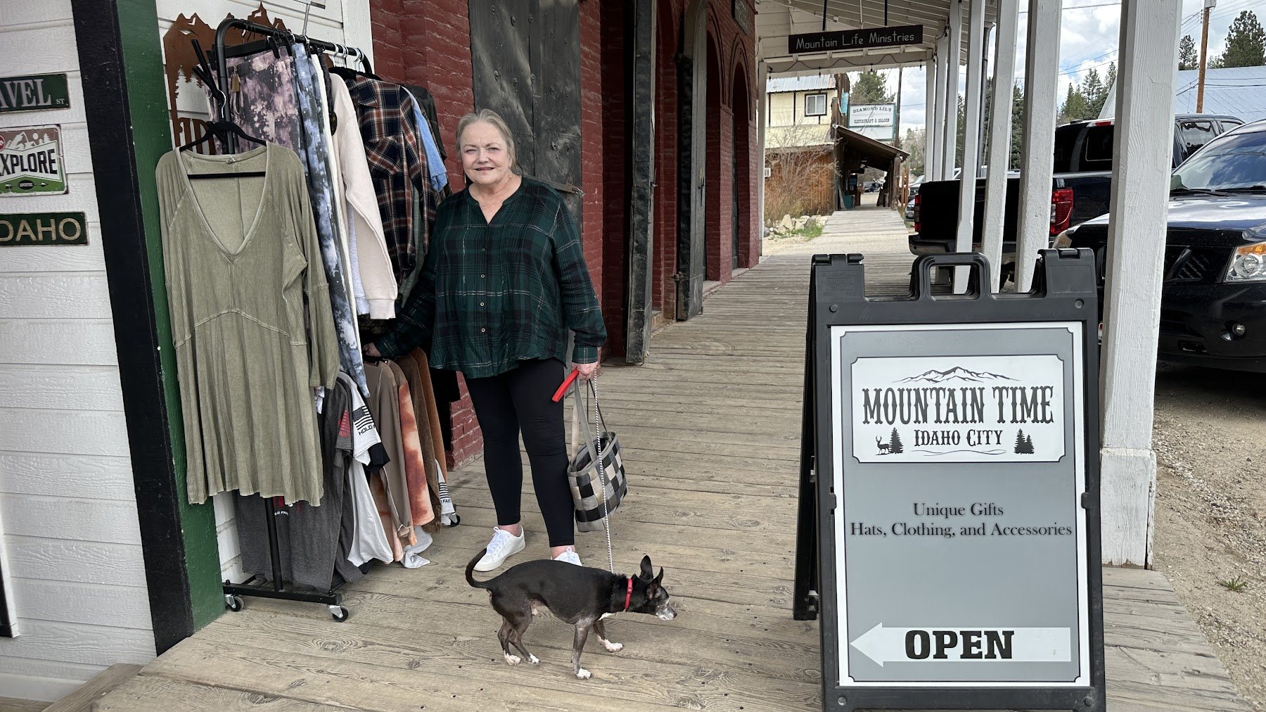 Family member standing near a storefront sign