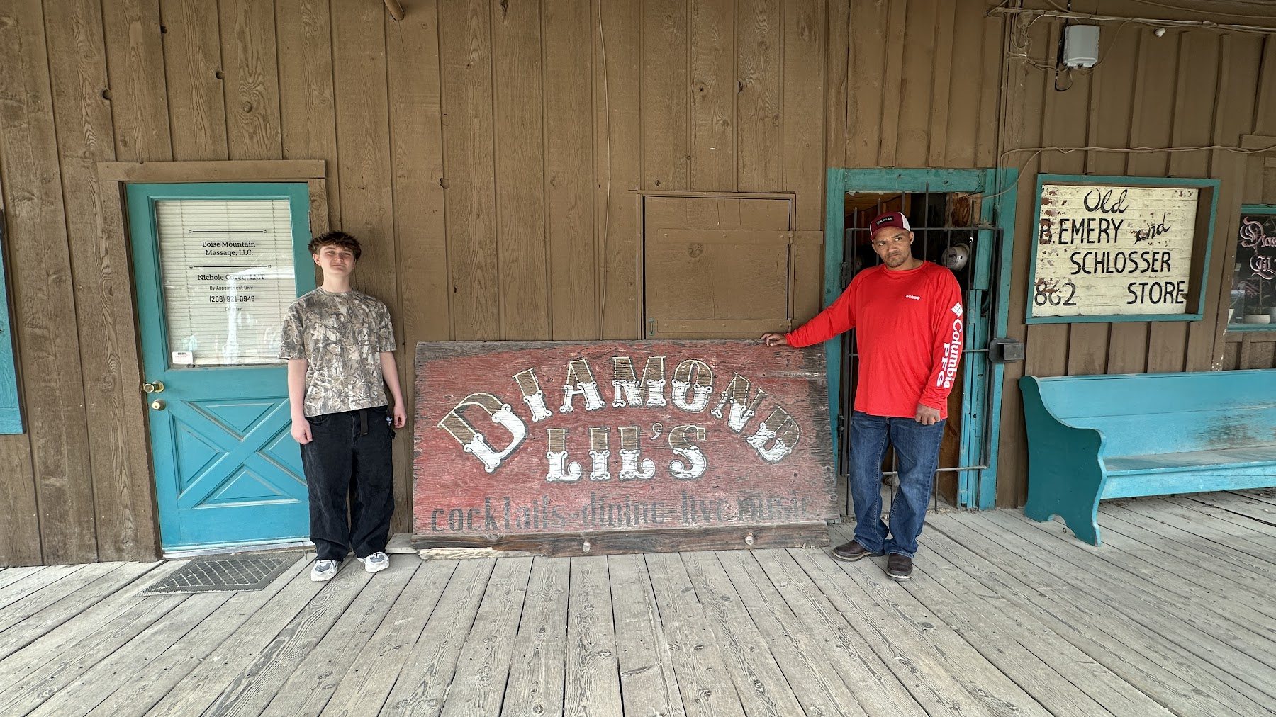 Family standing by the Diamond Lil's sign