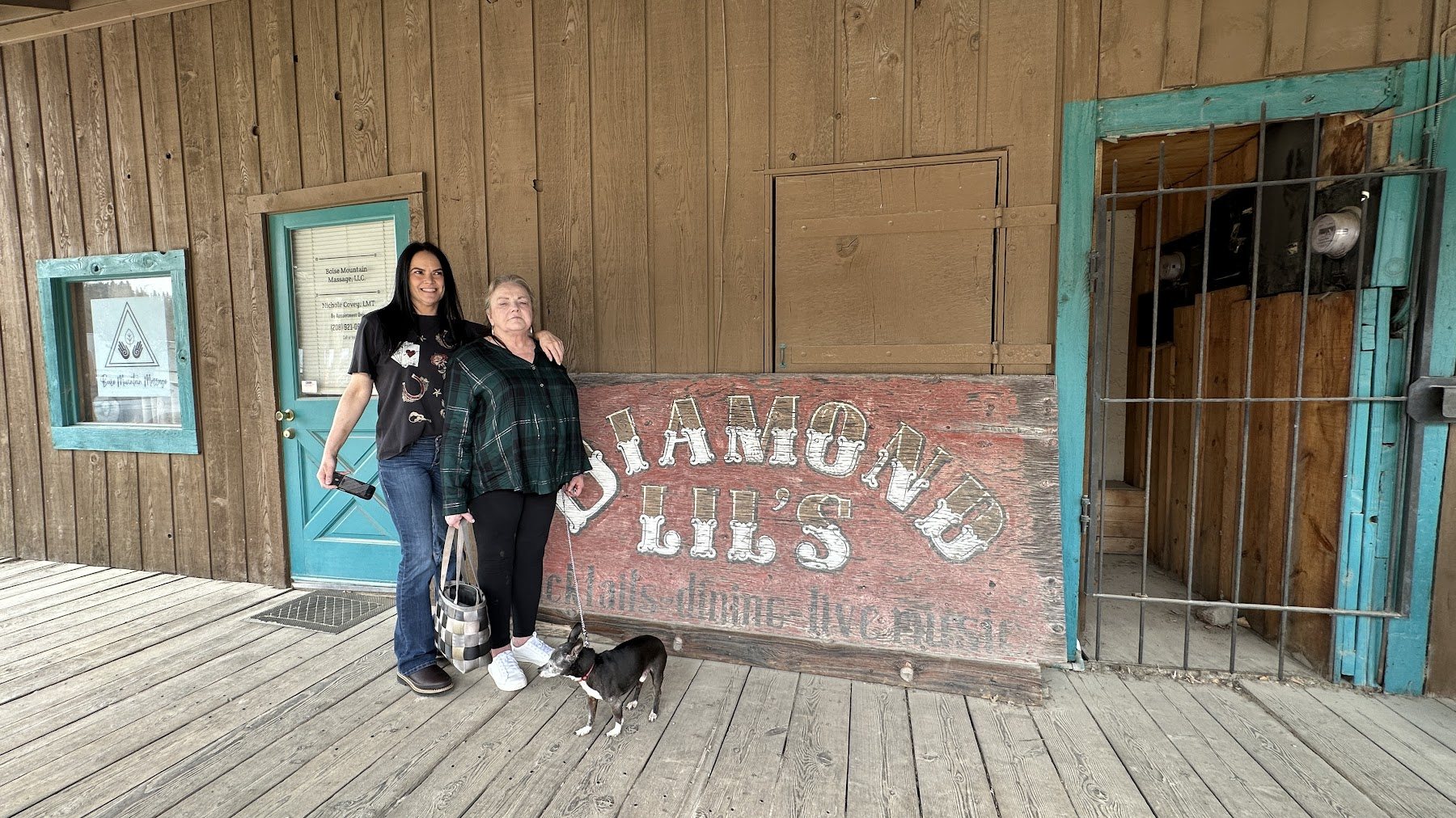 Family posing by the Diamond Lil's sign